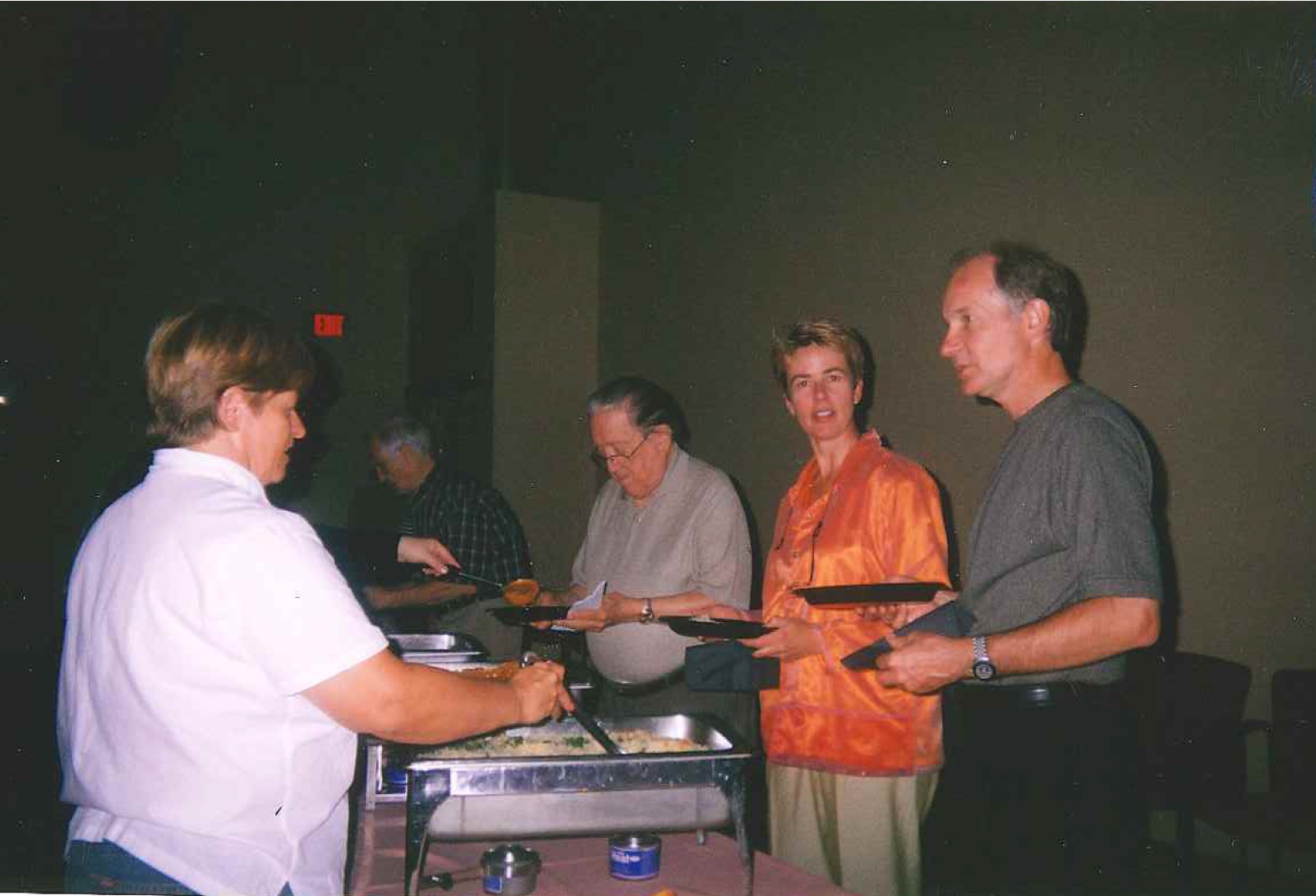 Ross members at a party serving themselves food, older photo
