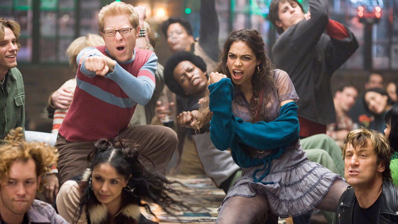 Anthony Rapp, Rosario Dawson, and cast in a scene from Rent.